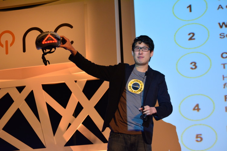 Lumos presents its integrated safety helmet, complete with traffic signals, at Brinc's Launch Consumer IoT Summit at StartmeupHK in Hong Kong (photo credit: Masaki Masuda, Techwave.jp)